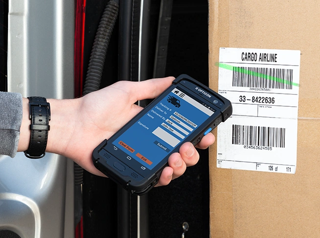 Android Mobile Computer used to scan barcodes on a box in a van