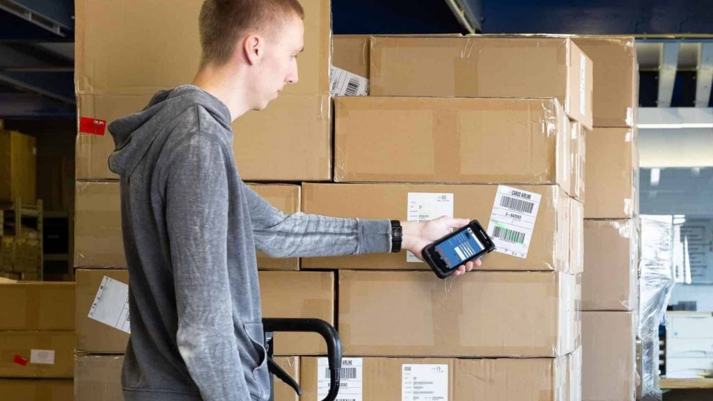 H-28 Android Mobile Computer used to scan barcodes on boxes in a warehouse