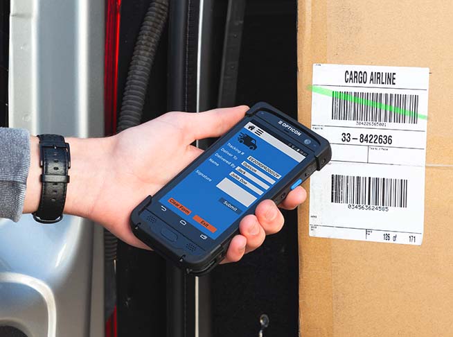 H-28 Android Mobile Computer used to scan barcodes on a box in a van